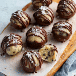 Cookie Dough Truffles: 7 Steps to Perfect No-Bake Bliss 9 Finished Cookie Dough Truffles on wooden board with sea salt and chocolate drizzle — no-bake dessert perfection.