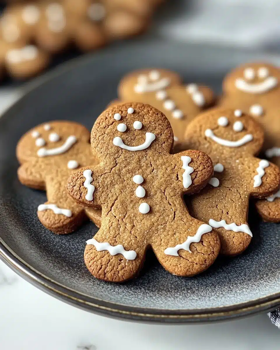 Deliciously decorated gingerbread cookies on a festive holiday plate.