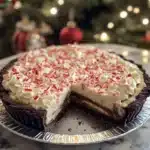 Quick Christmas Peppermint Pie decorated with whipped cream and candy canes