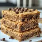 Delicious golden chewy peanut butter blondies on a cooling rack.