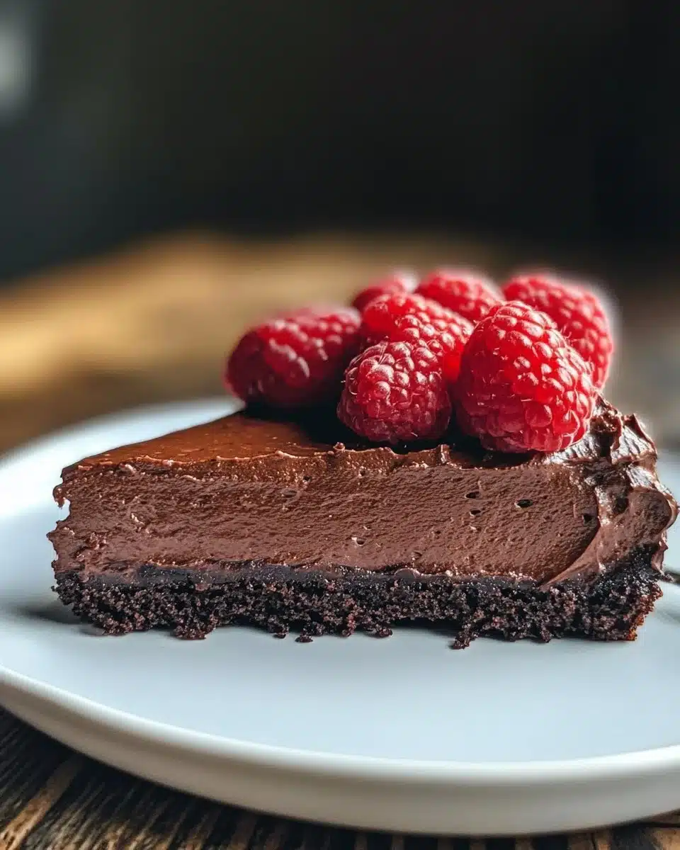 Decadent chocolate mousse cake topped with rich chocolate ganache