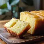 Lemon Zest Pound Cake slice garnished with lemon slices