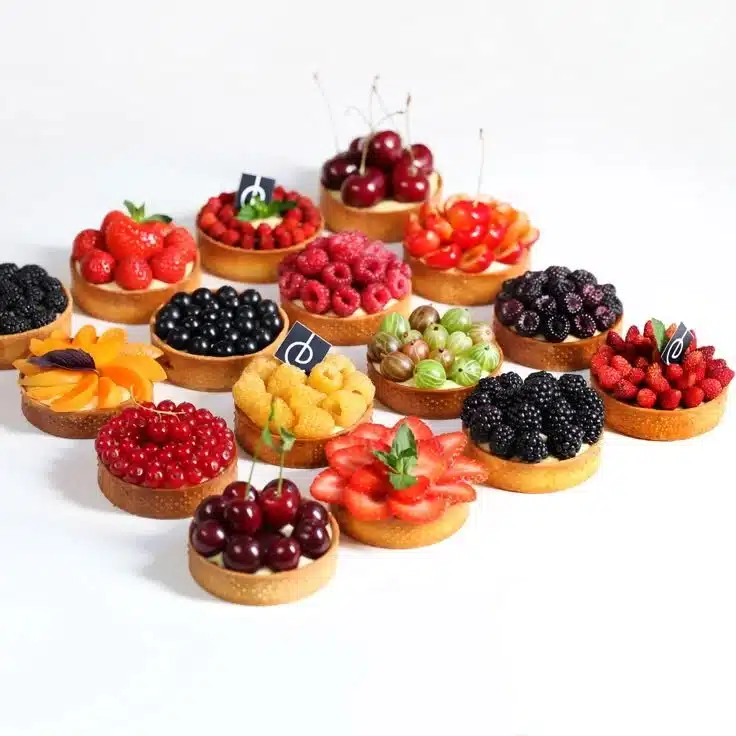 Delicious minute summer berry tarts topped with fresh berries